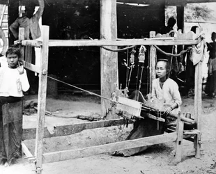 Burmese Woman Seated at a Loom